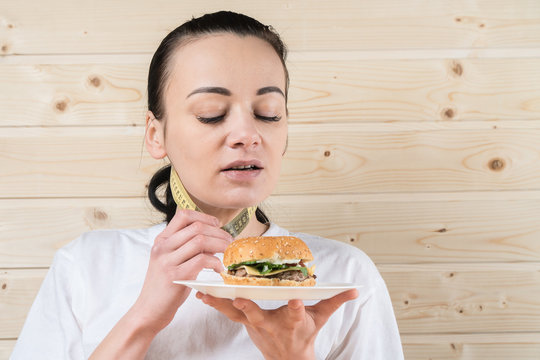 picture of healthy woman rejecting junk food