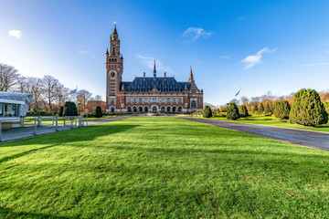THE HAGUE, 4 December 2018 - Front view of the Peace Palace, seat of the International Court of Justice, view from the peaceful entrance with the green grass field