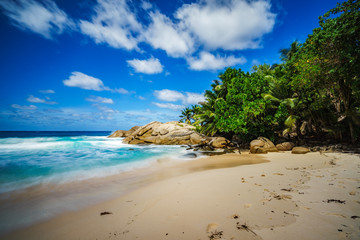 beautiful paradise tropical beach,palms,rocks,white sand,turquoise water, seychelles 23