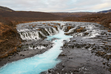 Bruarfoss (Bridge Fall), is a waterfall on the river Bruara, in southern Iceland where a series of small runlets of water runs into a beautiful, turquoise-blue colored pool.