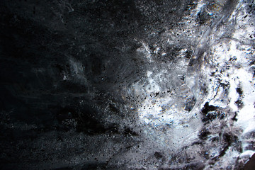 Ice Block covered with black sand