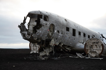 Fototapeta na wymiar Wreckage of Crashed Airplane DC7 on the Coast of Iceland Black Sand Beach