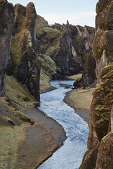 Deep Fjadrargljufur canyon and river flowing along the bottom of the canyon in south east Iceland