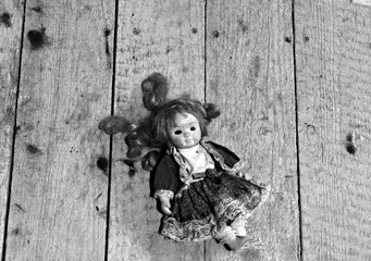 doll on a wooden background
