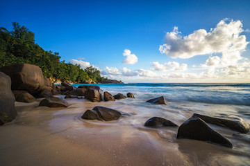 Fototapeta na wymiar sunset in paradise.shadows of rocks,tropical beach,anse intendance,seychelles 15