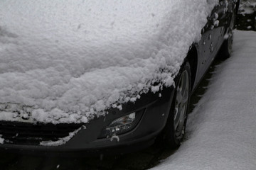 Car covered with snow after heavy snowfall