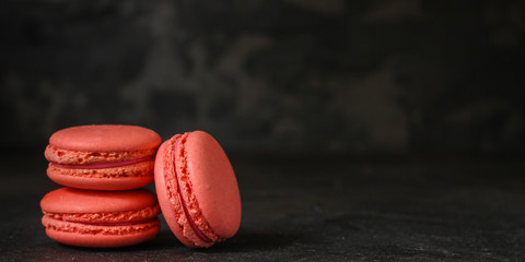 macaron or macaroon cake, colorful cookies (dark background). copy space