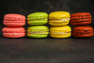 macaron or macaroon cake, colorful cookies (dark background). copy space