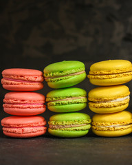 macaron or macaroon cake, colorful cookies (dark background). copy space