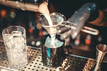 Cocktail Preparation. The barman is preparing a drink.
