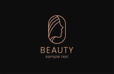 Beauty woman fashion logo. Golden Abstract vector template linear style on a black background