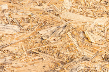 An abstract image of plywood board. Surface texture of oriented strand board (OSB). Plywood texture background