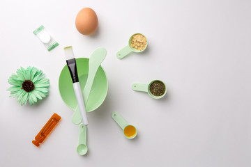 Ingredients for homemade face mask or hair. Castor oil, essential oils, mustard, dry nettle leaves.