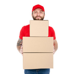 Delivery man in red uniform holding box package isolated on white background