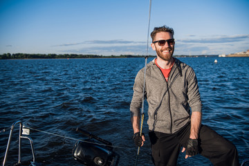 Sailing boat with skipper on a stern
