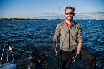 Sailing boat with skipper on a stern