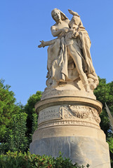 Obraz premium Public XIX century sculpture of the famous British poet Lord Byron crowned by personification of Greece in the National Garden in Athens, Greece with blue sky copy space.