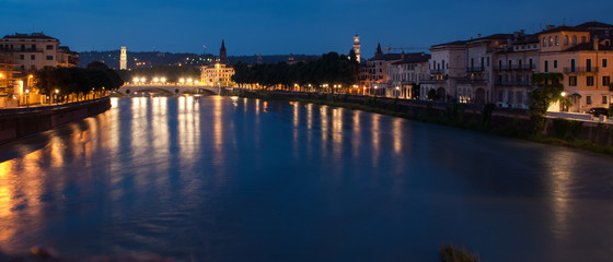 Fototapeta premium Verona, Italy. Stone Bridge on the Adige river at night. The only one left from the Roman era