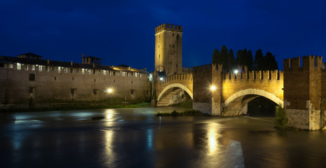 Verona, Italy. Castelvecchio bridge at night. The bridge of Castelvecchio, also known as the Scaliger bridge, is a bridge of Verona on the Adige river which is part of the Castelvecchio fortress