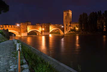 Verona, Italy. Castelvecchio bridge at night. The bridge of Castelvecchio, also known as the...