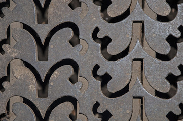 Texture and background metal with holes. Ornament on the iron .
