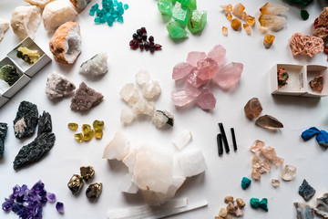 Collection of beautiful precious stones on white table.