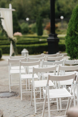 White chair on wedding ceremony. summer wedding decoration outside