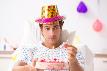 Young man celebrating his birthday in hospital