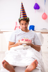 Young man celebrating his birthday in hospital