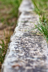 Boundary line in lawn made of limestone