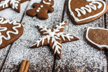 Christmas homemade gingerbread cookies on a wooden background. New year and christmas postcard
