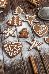 Christmas homemade gingerbread cookies on a wooden background. New year and christmas postcard