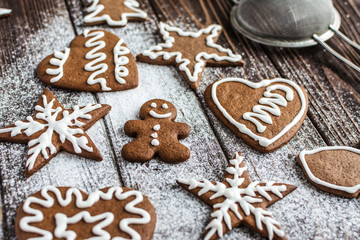 Christmas homemade gingerbread cookies on a wooden background. New year and christmas postcard