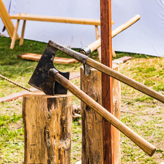 Vintage axes stuck in a log
