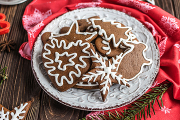 Christmas homemade gingerbread cookies on wooden background. New year and christmas postcard