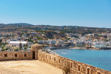 Fototapeta na wymiar Aerial view on Mediterranean sea bay from wall of Rethimno fortress, Crete island, Greece 
