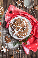 Christmas homemade gingerbread cookies on wooden background. New year and christmas postcard