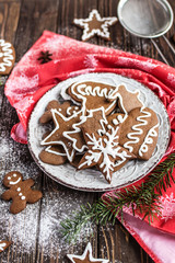 Christmas homemade gingerbread cookies on wooden background. New year and christmas postcard