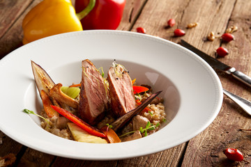 Sous Vide pork medallions with forest mushrooms and pearl barley risotto