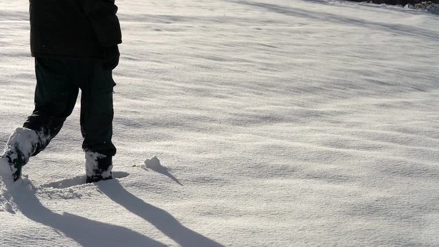 Man going through deep snow - (4K)