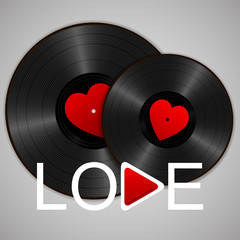 Two Realistic Black Vinyl Records with red heart labels, word love and play button. Retro Sound Carrier on gray background.