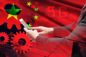 China flag 5G network wireless systems and internet of things (iot), Digital smart city and communication network. Very fast connect global wireless devices.Man suit play smartphone background.