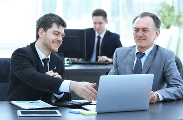 employees working with financial documents in the office