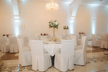 Decorated restaurant on the wedding day. Inside. Interiors