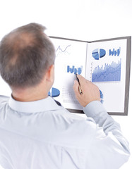 rear view. businessman reading a financial document
