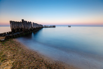 Obraz premium Blue hour at the sea. Beautiful and tranquil sunset over the sea