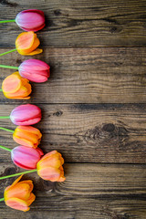 Vertical wooden background with tulips
