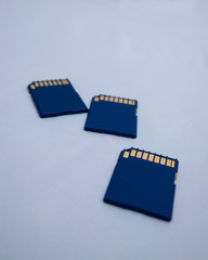 Sdhc memory cards on light background. Tree blue standart memory cards.