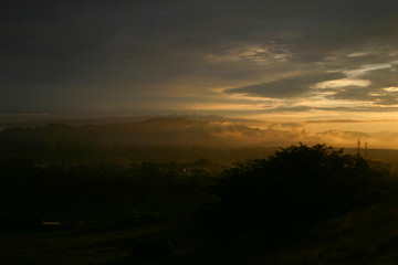 Sunrise over town in the mountains