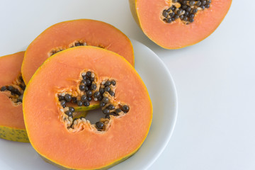 Sliced papaya on white background